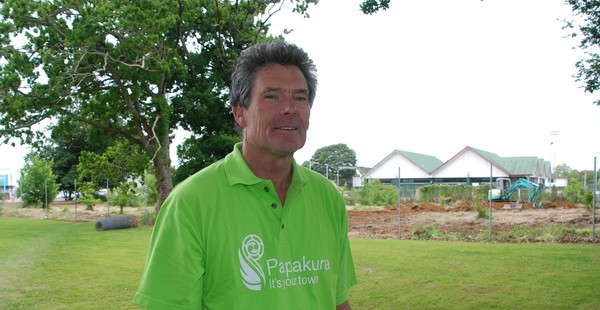 Councillor Peter Jones at the site as work proceeds to remove old tree stumps and scrub and level the site for grassing.